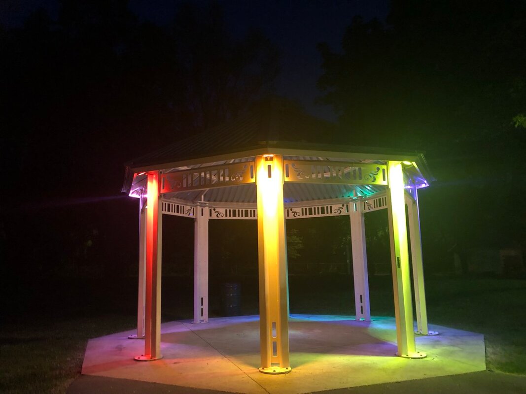 The lit in rainbow colours. Each pillar is a different colour.